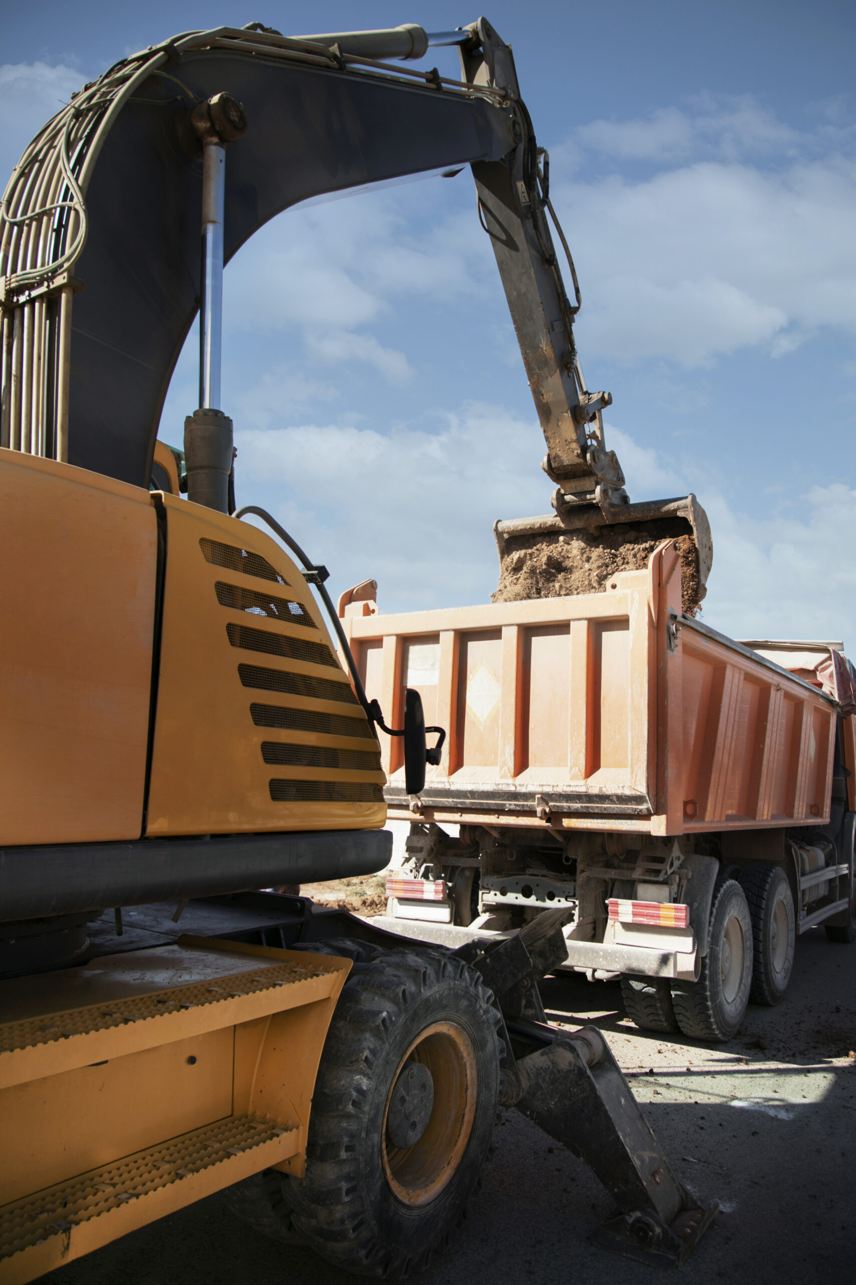 About excavator digging ground day light
